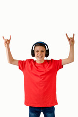 Teenage boy making rock n roll hand gesture