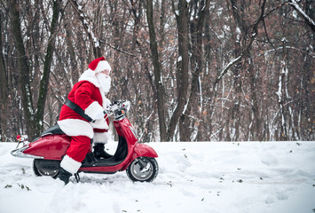 Santa Claus riding on scooter © LIGHTFIELD STUDIOS
