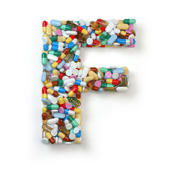 Letter F. Set of alphabet of medicine pills, capsules, tablets and blisters isolated on white.