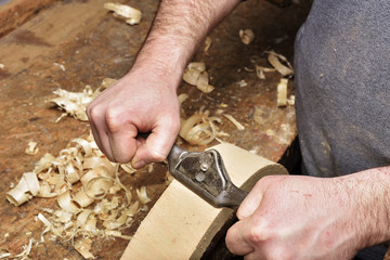 Carpenter working. Carpenter tools on wooden table with sawdust. Carpenter workplace