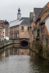 Obraz premium View of canals and streets of Gent town, Belgium in rainy day in winter