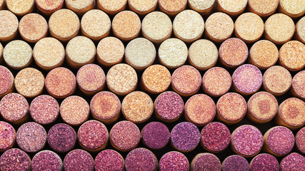 Background of used wine corks.  Wine corks from white and red wine arranged in rows by color. Wine stopper.