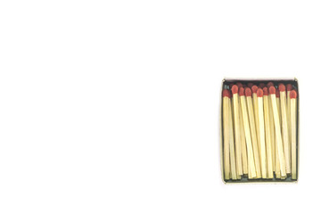 Open box of matches with red head on white background