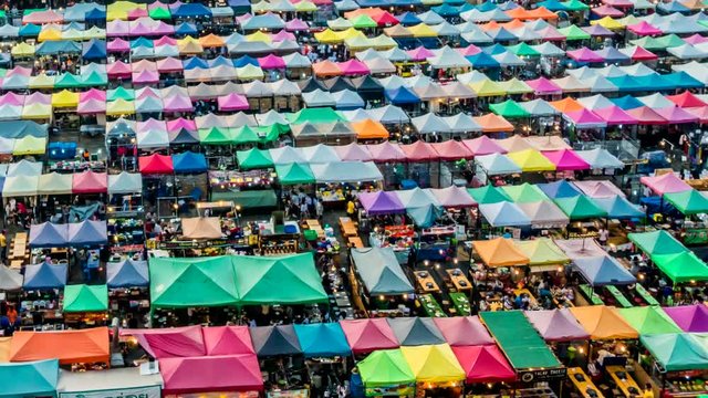  Night market with colorful tent.
