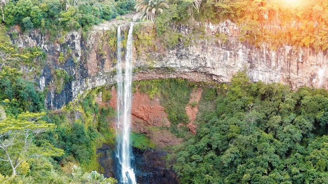 Waterfall in the jungles panorama view slow motion. Scenic Chamarel waterfall. Mauritius island