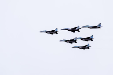 Air show in the sky above the Krasnodar airport flight school. Airshow in honor of Defender of the...