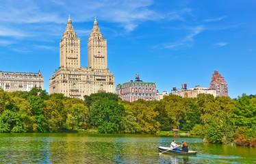 View of the Central Park with people rowing on the lake in New York City