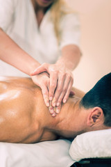 Fototapeta na wymiar Sports massage - Massaging Neck