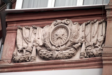 bas-relief on the wall of a house in the city