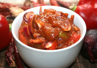 Traditional Bulgarian Lecho from sweet pepper, hot appetizer, sweet pepper, sweet paprika, Mediterranean cuisine, tomatoes, red sweet onions, red peppers, a salad of red sweet paprika