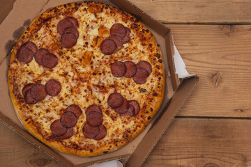 Hot Sliced Pepperoni Pizza In Delivery Box