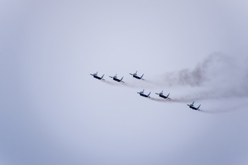 Air show in the sky above the Krasnodar airport flight school. Airshow in honor of Defender of the Fatherland. MiG-29 in the sky.