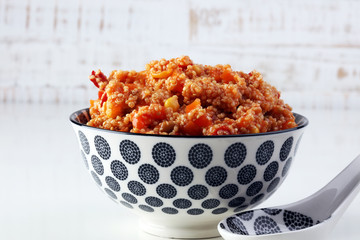 Delicious vegetarian quinoa salad with bell pepper, cucumber and tomatoes