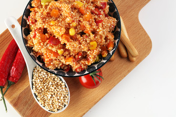 Delicious vegetarian quinoa salad with bell pepper, cucumber and tomatoes