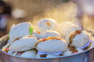 Soft focused of steamed pork bun, Thai style