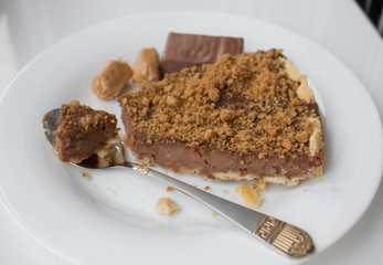 Homemade chocolate tart on a white plate