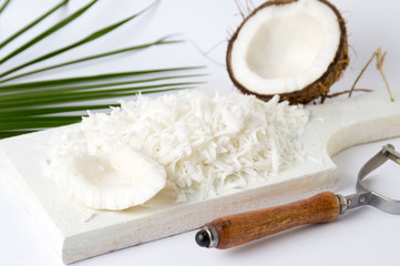 Fototapeta na wymiar Grated coconut on a wooden board