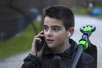 child talking on the phone on the street