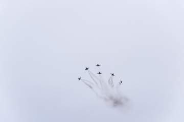 Air show in the sky above the Krasnodar airport flight school. Airshow in honor of Defender of the Fatherland. MiG-29 in the sky.