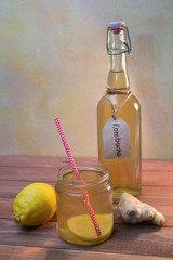 Vintage bottle and jar with Kombucha tea with lemon and ginger