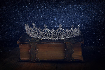 low key of diamond queen crown on old book