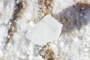 A piece of ice lay on the snow