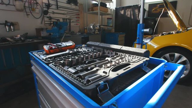 A kit of tools for repair - screwdriver, voltmeter, wrenches - automobile service