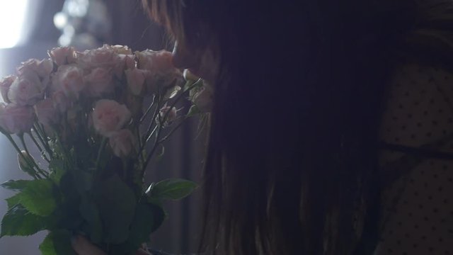 Portrait of female with bouquet of flowers