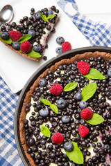 Delicious tart with blueberries and raspberries
