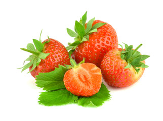A pile of ripe strawberries with leaves isolated.