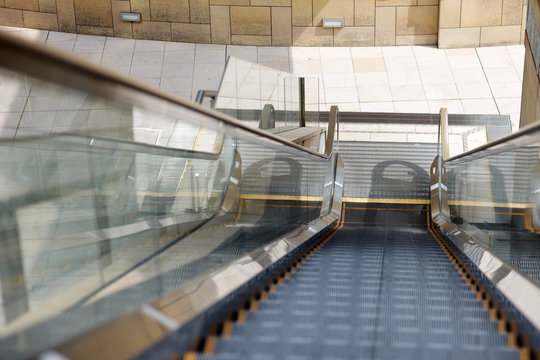 The escalator at the entrance to the building of the business center.