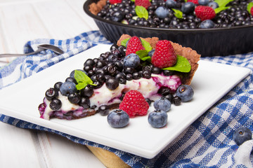 Delicious tart with blueberries and raspberries