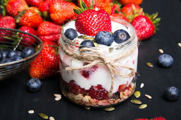 delicious dessert - yogurt with strawberries and blueberries