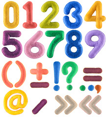 Handmade multicolor number set with punctuation marks from felt isolated on white background