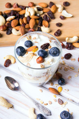 Healthy dessert with yogurt, nuts, oats and blueberries
