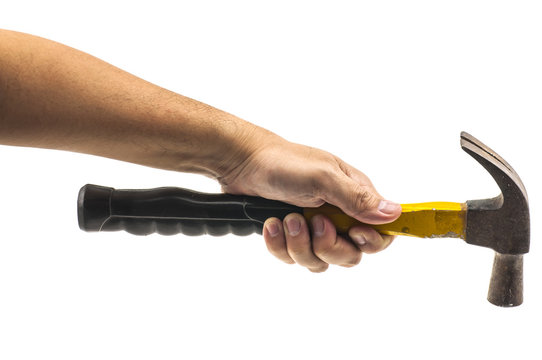 Man's hand holding old yellow hammer isolated over white. Photo includes clipping path