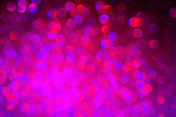 Purple pink abstract shiny bokeh background. Photo is blurred and filtered.