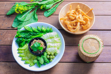 Pork chili paste, northern Thai food, served with boiled vegetable crispy pork and sticky rice box