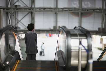People on the escalator at the mall. Japan.