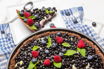 Delicious tart with blueberries and raspberries