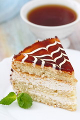 Delicious cake with cream and caramel