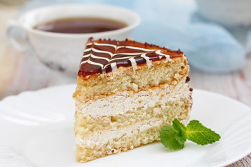 Delicious cake with cream and caramel