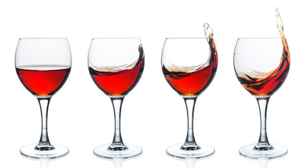 Set of wine glasses with red wine on white background