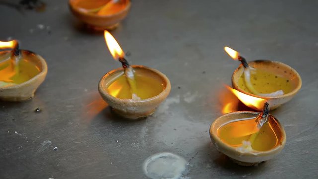 Tiny, Handmade Candles Burn on a Buddhist Altar in Singapore