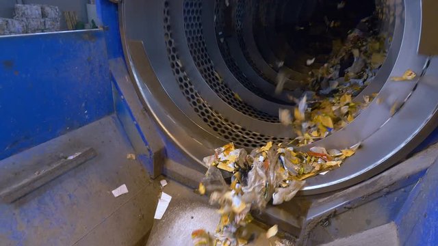 Sorting garbage equipment working at a recycling plant. 4K.