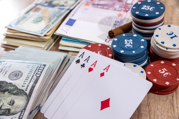 poker combinations - chips, paly card, money on desk.