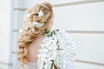 girl with blond hair with makeup and flowers