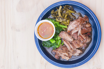 Stewed pork leg set over wooden table