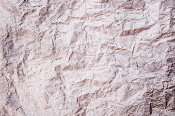 Light red tone crumpled paper abstract background