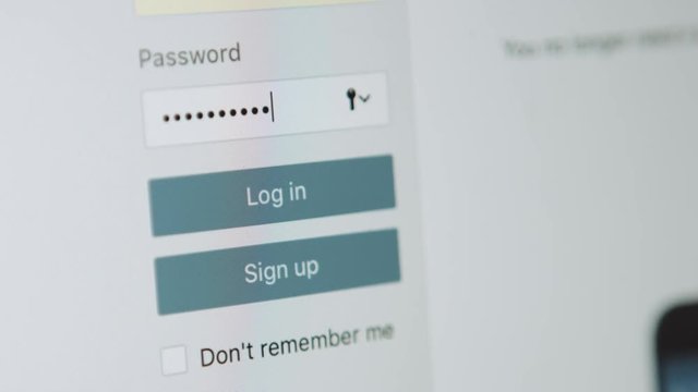 Closeup enters the password to log in social network account